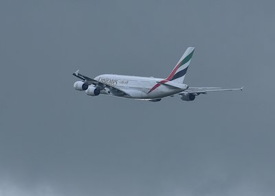A380 heading into grey skies.
