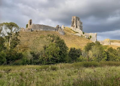 Corfe Castle in the early evening sun.